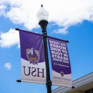 Photo of HSU flyer on a Street Light.